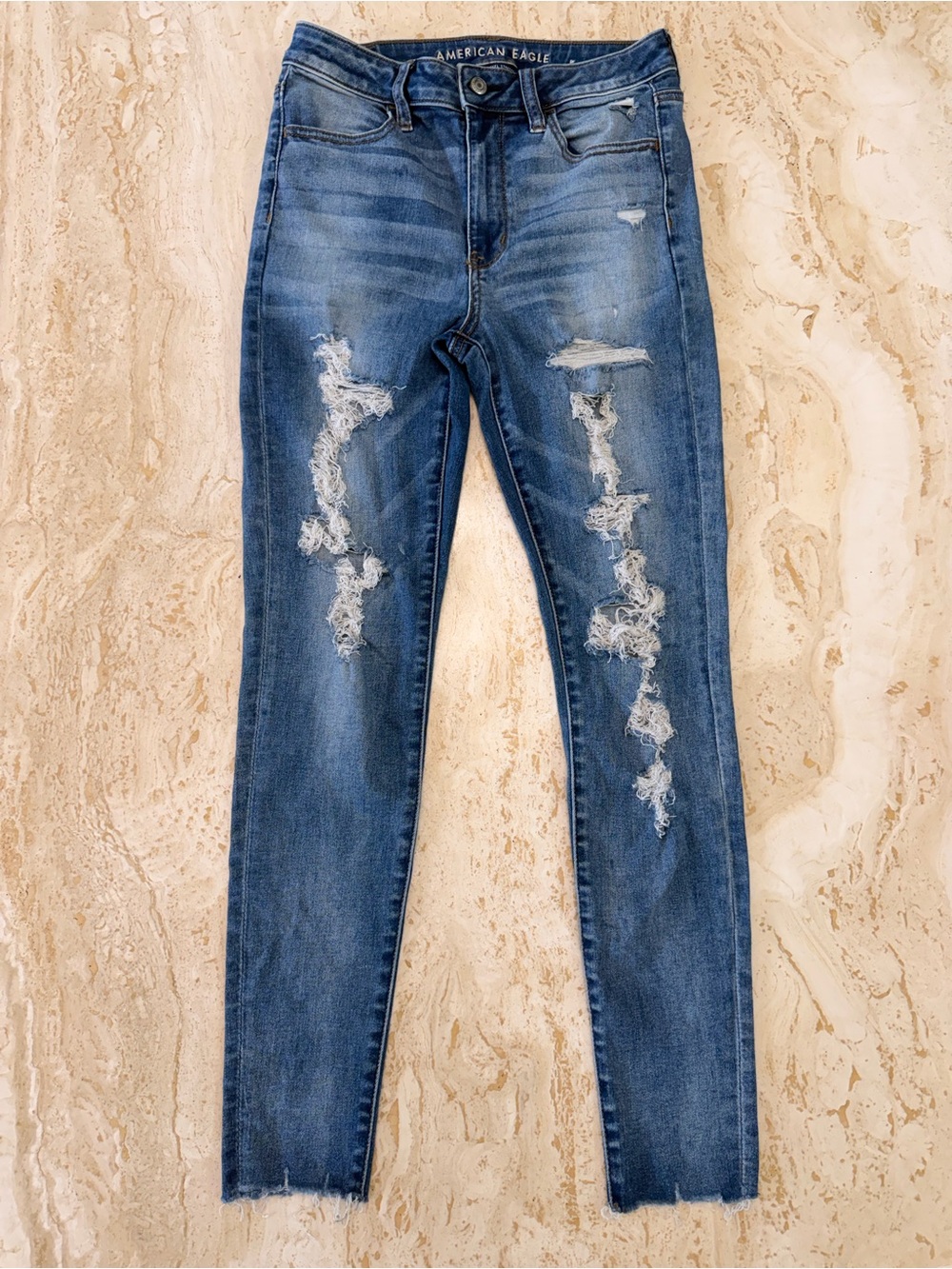 American Eagle Outfitters Women's Distressed super Hi-Rise Jegging Blue Wash